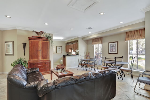 living room with light tile patterned floors, plenty of natural light, and crown molding