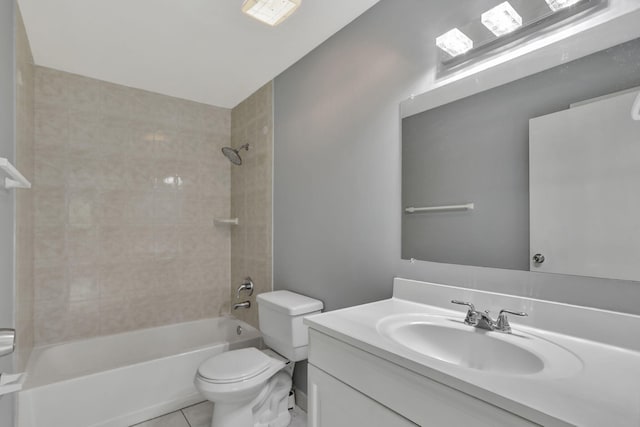 full bathroom with tile patterned flooring, tiled shower / bath, toilet, and vanity