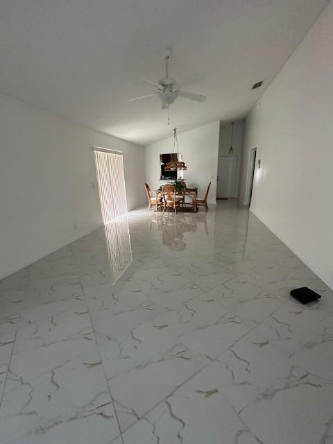 unfurnished dining area with ceiling fan