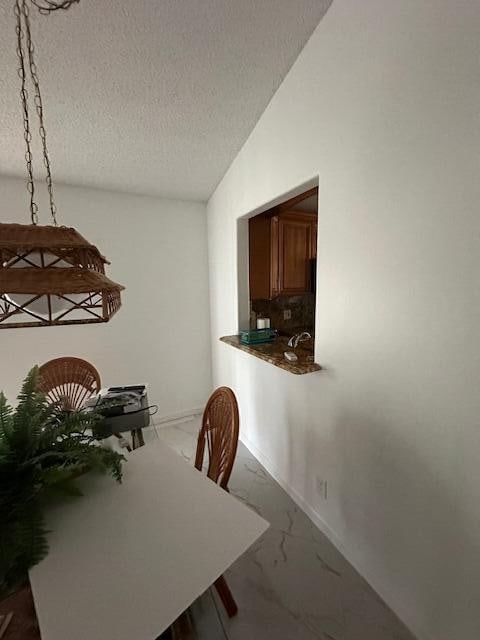 dining area with a textured ceiling