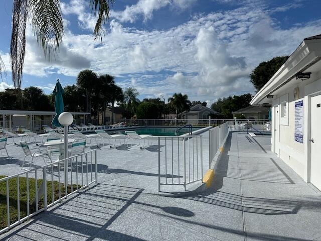 view of swimming pool with a patio area