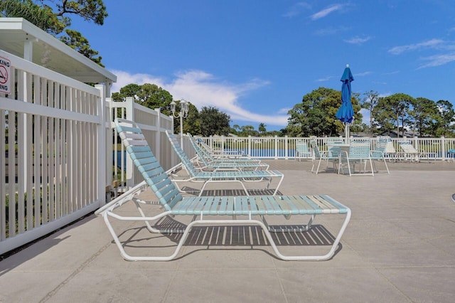 view of patio / terrace featuring fence