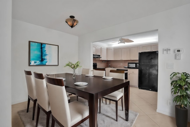 dining room with ceiling fan and light tile patterned floors