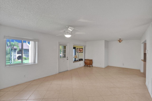 442 Pine Glen Ln Unit B2, Greenacres, FL 33463 - spare room with a textured ceiling and ceiling fan