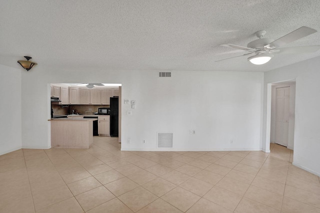 442 Pine Glen Ln Unit B2, Greenacres, FL 33463 - unfurnished living room with light tile patterned floors, visible vents, a textured ceiling, and a ceiling fan