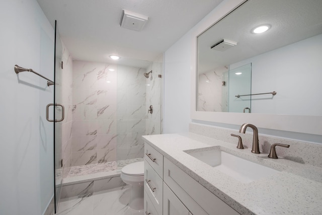 bathroom featuring an enclosed shower, vanity, toilet, and tile patterned flooring