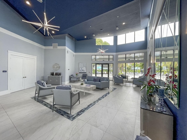 lobby featuring a high ceiling and recessed lighting