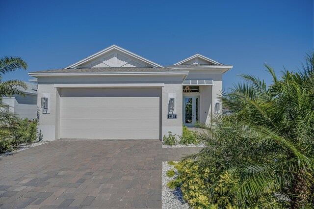 single story home with a garage