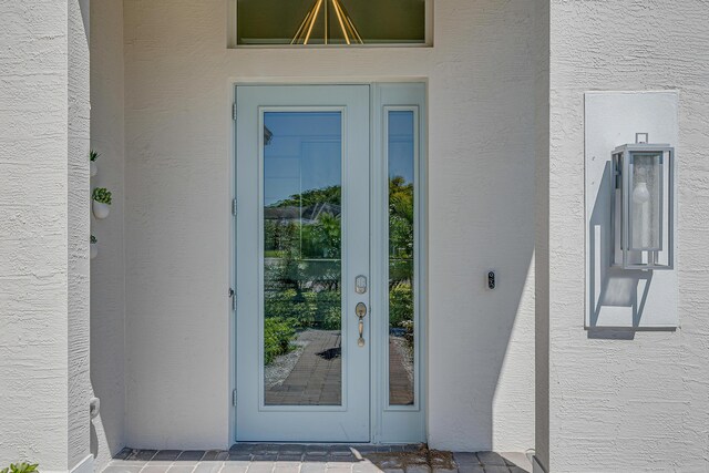 entrance to property featuring french doors