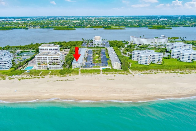 bird's eye view with a view of the beach and a water view