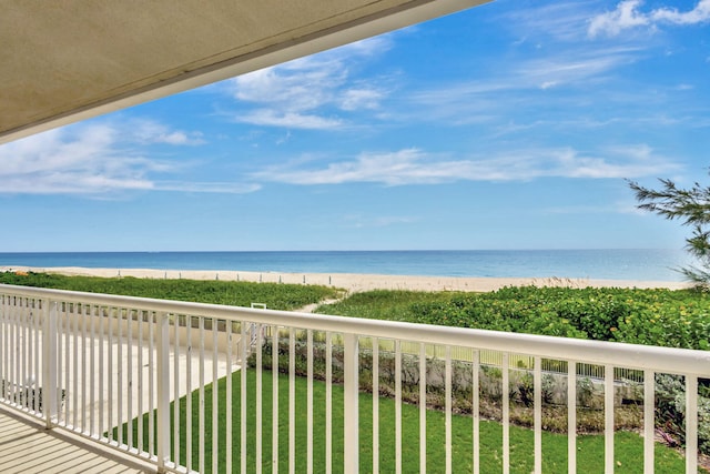 balcony with a view of the beach and a water view