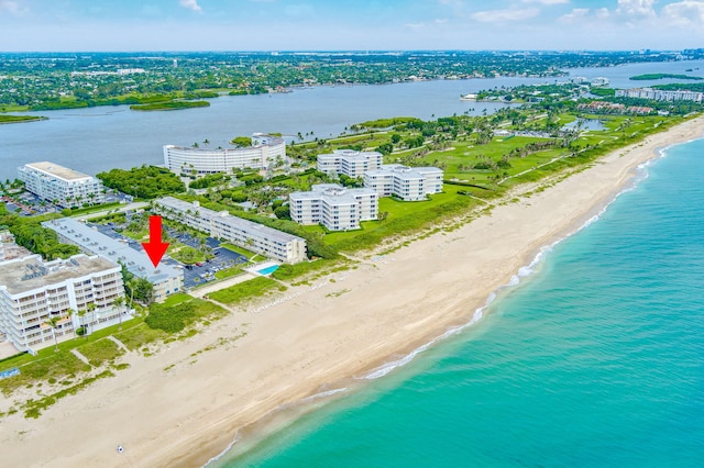 bird's eye view featuring a beach view and a water view