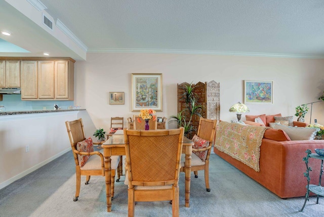 dining area with crown molding, light carpet, and a textured ceiling