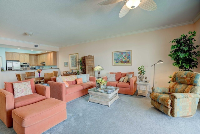 living room featuring ceiling fan, crown molding, light carpet, and a textured ceiling