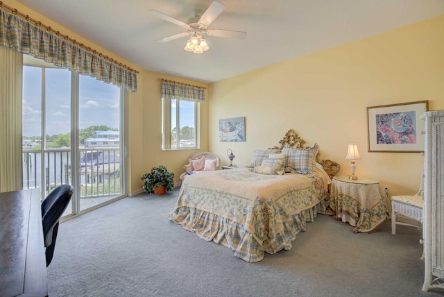 bedroom with ceiling fan, access to outside, and carpet floors