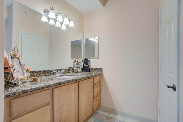 bathroom with tile patterned floors and vanity