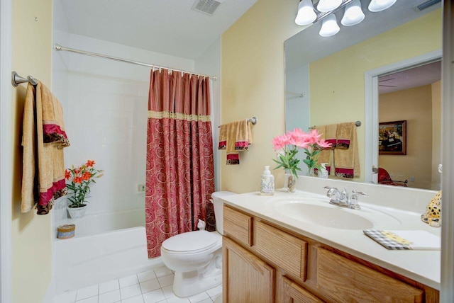 full bathroom with tile patterned floors, toilet, shower / tub combo, and vanity