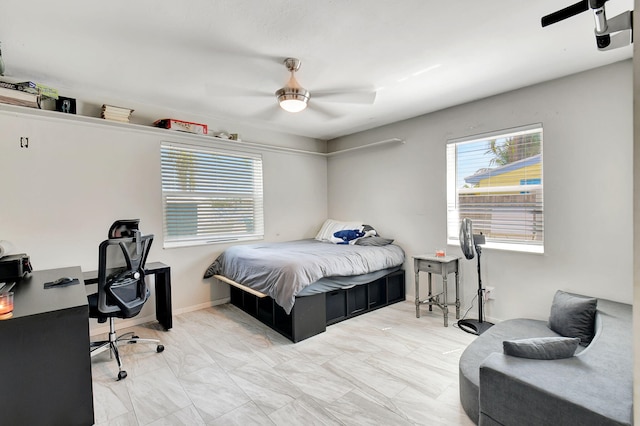 bedroom featuring ceiling fan and light tile patterned floors