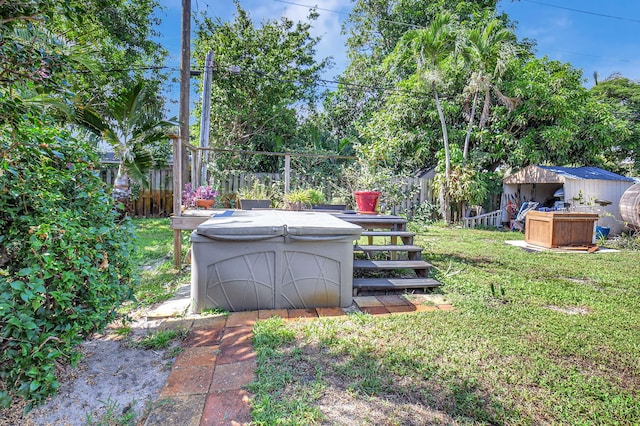 view of yard with a hot tub