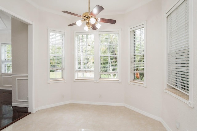 unfurnished room featuring crown molding, ceiling fan, and light hardwood / wood-style floors