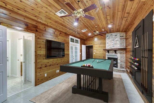 game room with vaulted ceiling, pool table, wood ceiling, a brick fireplace, and ceiling fan