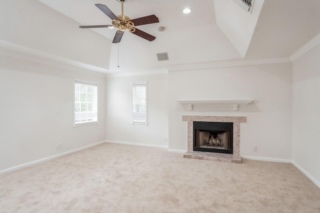 unfurnished living room featuring crown molding, light colored carpet, and ceiling fan