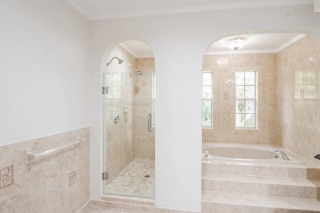 bathroom with independent shower and bath and tile patterned flooring