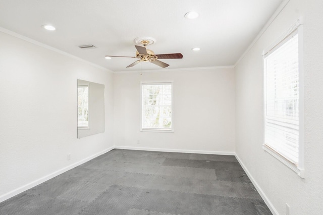 spare room featuring crown molding, ceiling fan, and carpet flooring