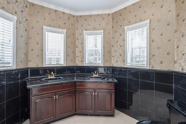 bathroom featuring tile walls, plenty of natural light, and ornamental molding