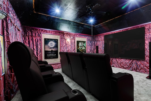 cinema with ceiling fan and carpet floors