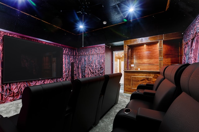 home theater room featuring light colored carpet