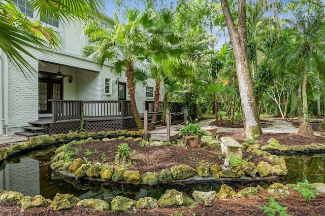 view of yard featuring a wooden deck