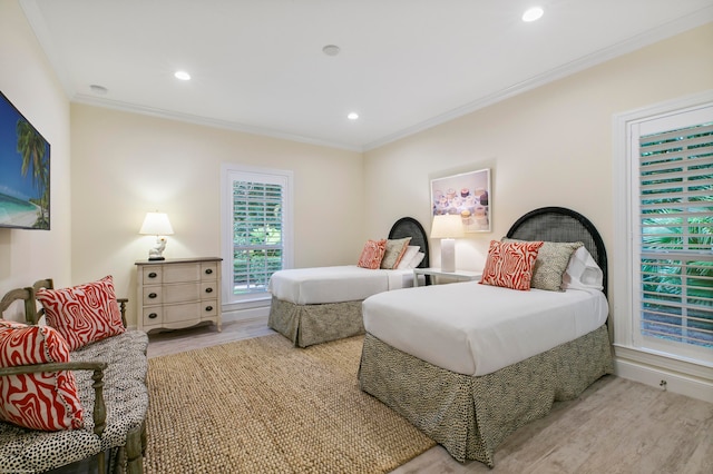 bedroom featuring ornamental molding and hardwood / wood-style floors