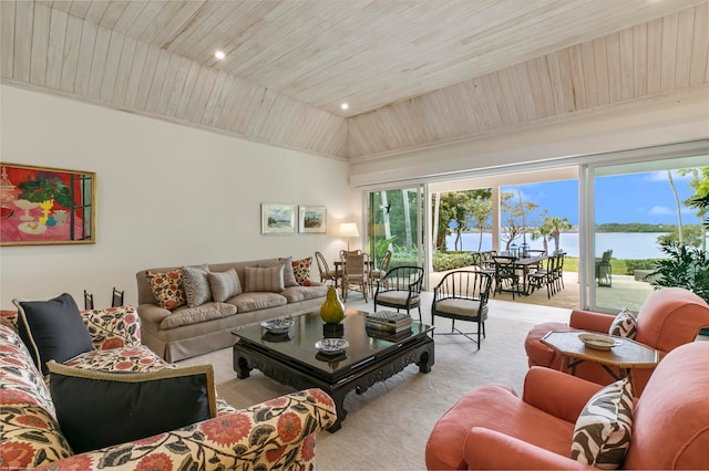 living room with wooden ceiling, a water view, and light colored carpet