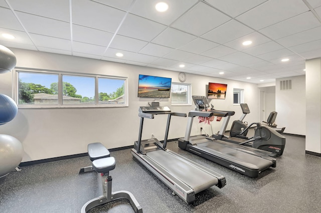 exercise room with a drop ceiling