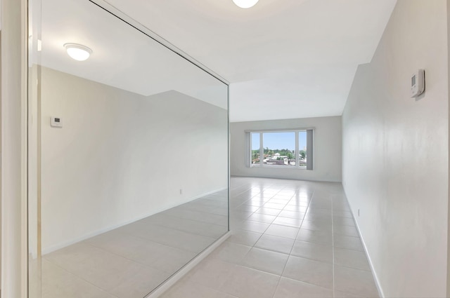 spare room with light tile patterned floors