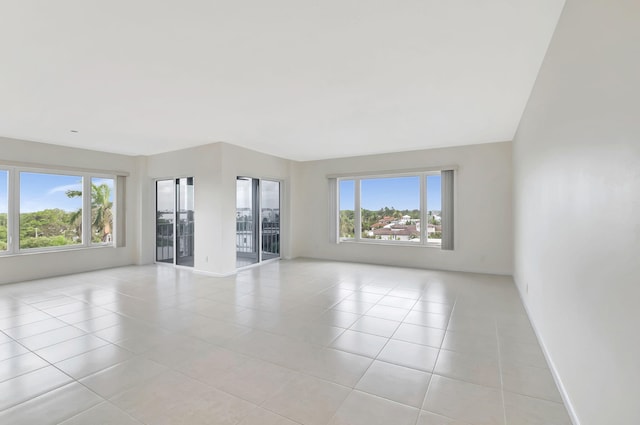 unfurnished room featuring light tile patterned flooring