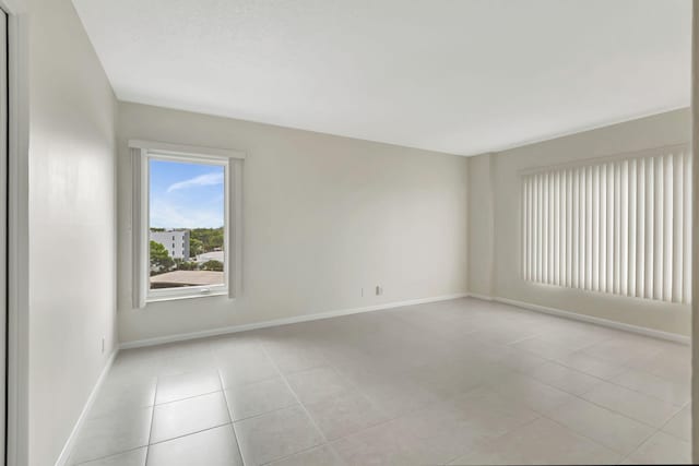 empty room featuring light tile patterned floors