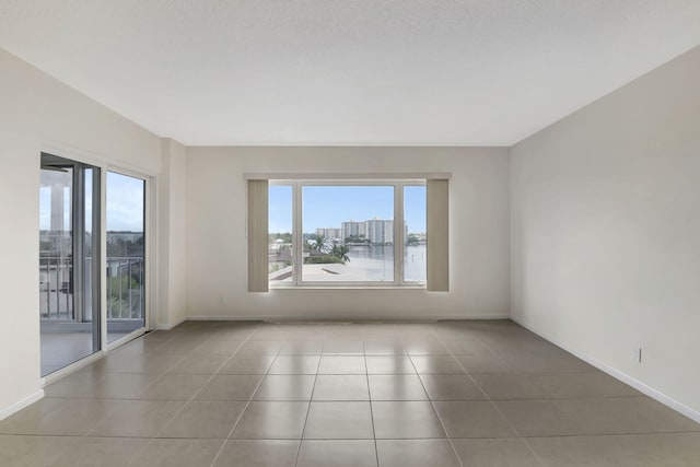 empty room featuring tile patterned flooring