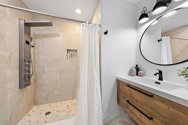 bedroom featuring ceiling fan, light hardwood / wood-style flooring, access to outside, and multiple windows