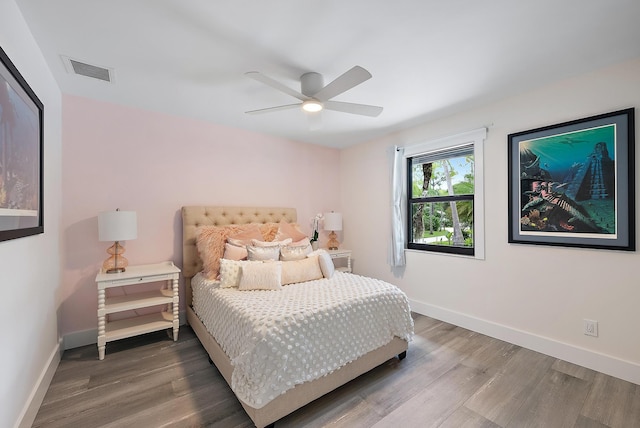 bedroom featuring ceiling fan and wood-type flooring