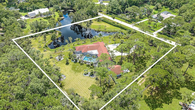 birds eye view of property with a water view