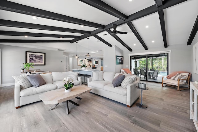 living room featuring ceiling fan, lofted ceiling with beams, and light hardwood / wood-style flooring