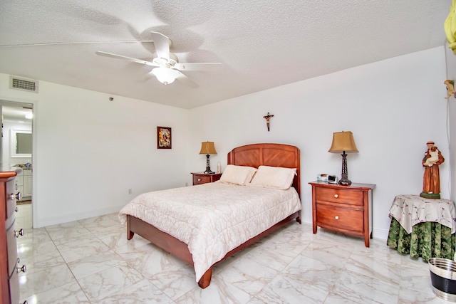 tiled bedroom with ceiling fan and a textured ceiling