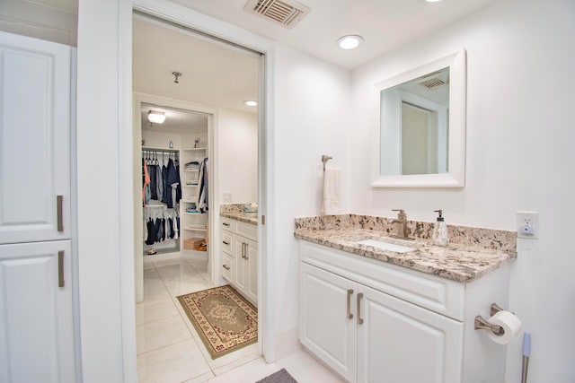 bathroom featuring vanity and tile patterned flooring