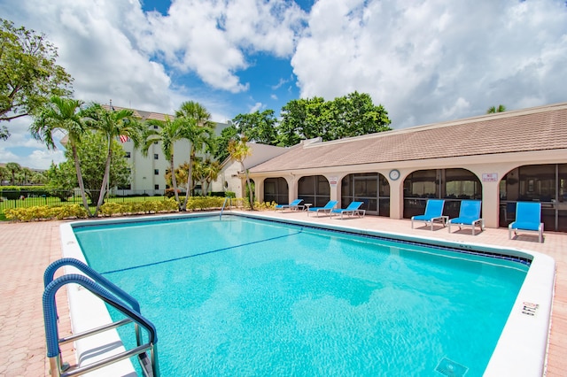 view of pool featuring a patio