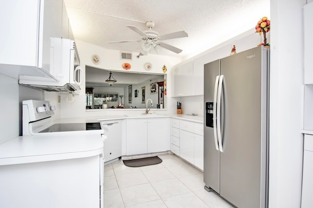 kitchen with ceiling fan, dishwasher, stainless steel fridge, stove, and light tile patterned floors