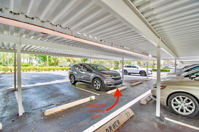 view of parking / parking lot with a carport