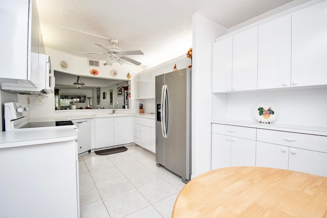 kitchen featuring stainless steel fridge with ice dispenser, light tile patterned flooring, ceiling fan, white cabinets, and stove