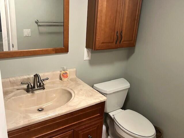 bathroom featuring vanity and toilet